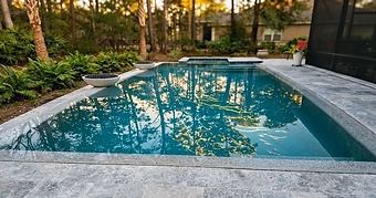 A geometric pool set in a travertine terrace